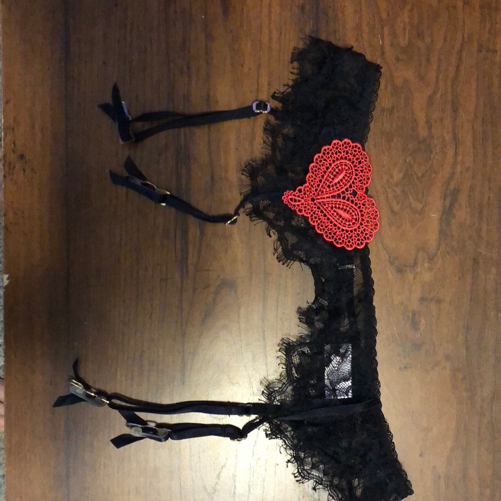 Very Sexy Victoria Secret lace garter belt with a red Lacey heart on the front.